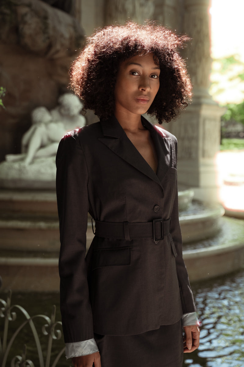 Wool blazer in grey with belt and exposed light blue lining on the sleeves