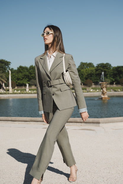 Wool blazer in sage green with belt and exposed light blue lining on the sleeves