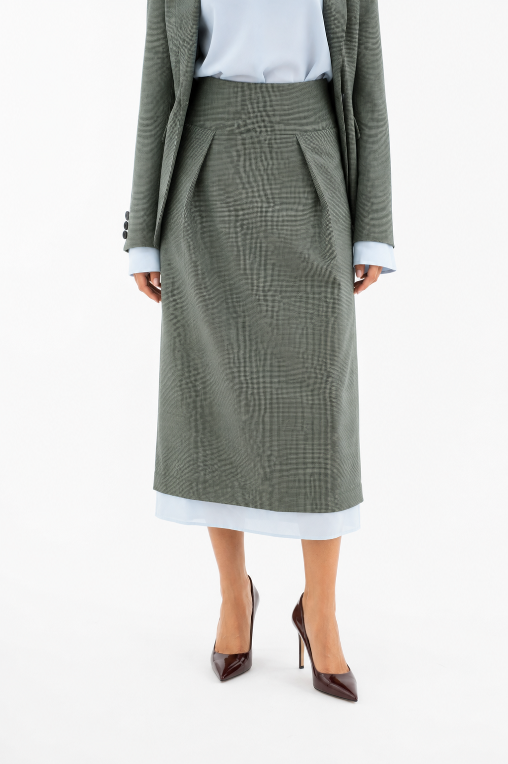 Midi wool skirt in green-and-black weave with exposed light blue lining
