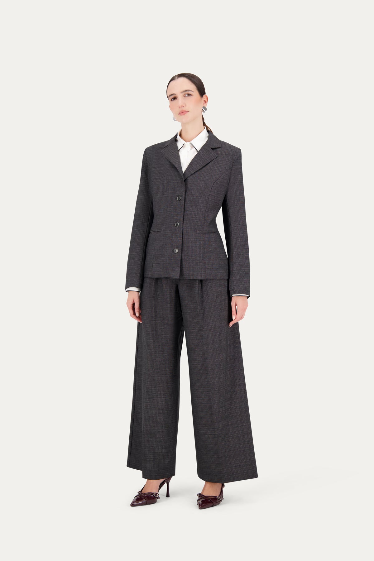 Princess-cut wool blazer with adjustable back belt in black-and-white weave