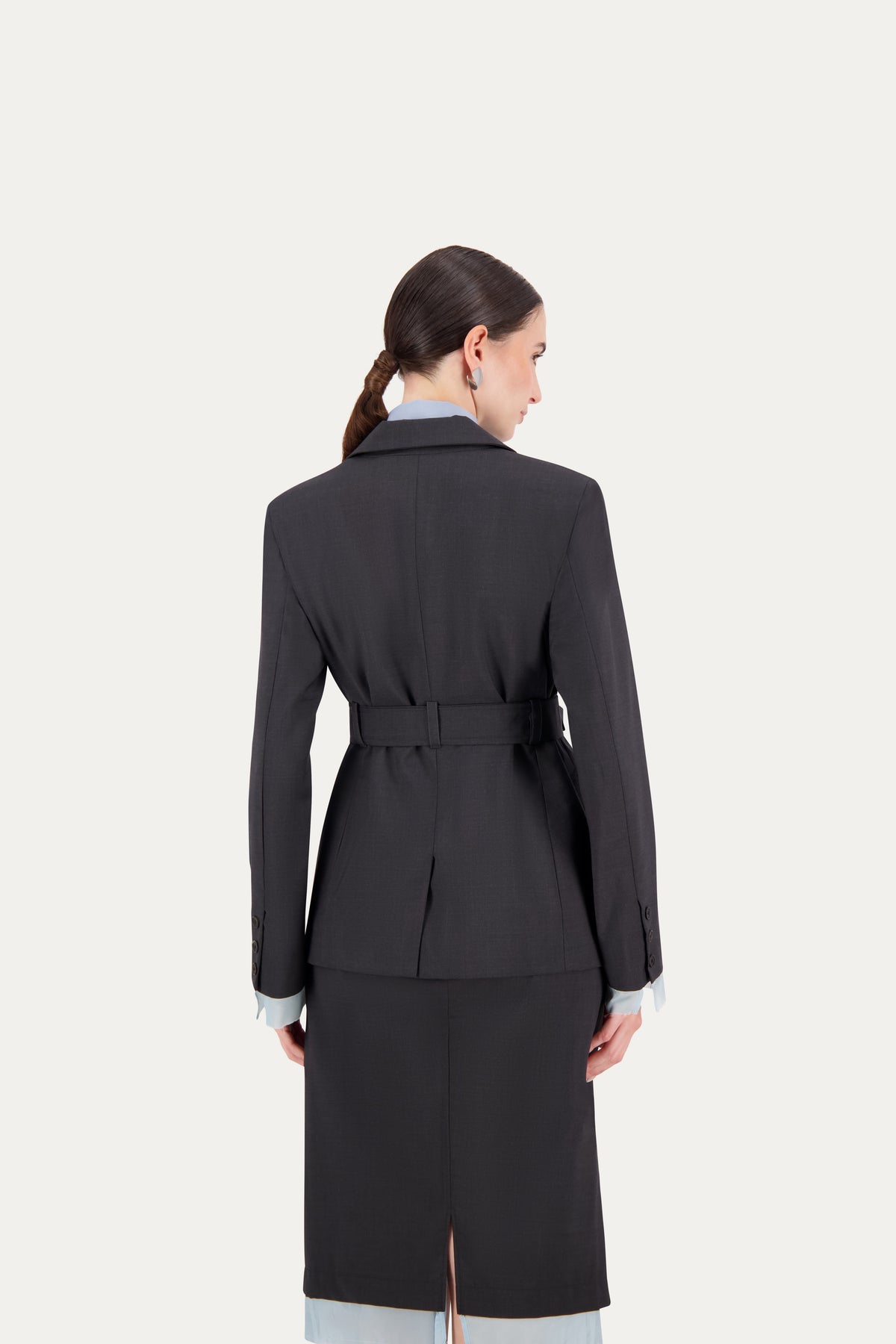 Wool blazer in grey with belt and exposed light blue lining on the sleeves