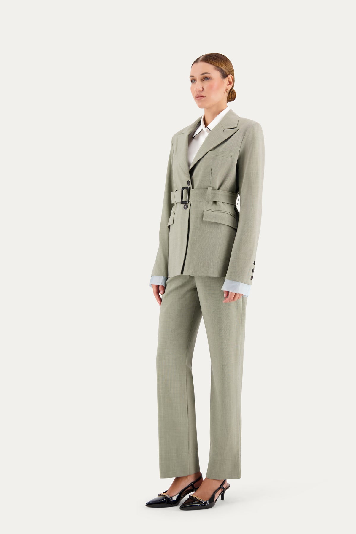 Straight-leg wool trousers in sage green with a small ankle slit