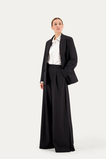 Pantalone sartoriale wide leg in lana nero con spacco laterale