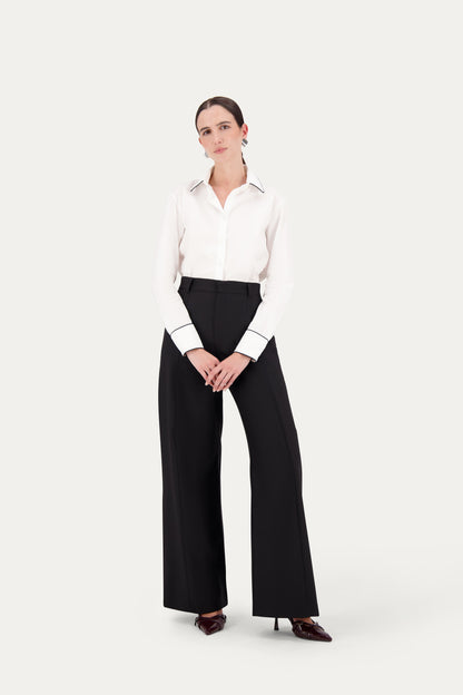 Pantalone sartoriale dritto in fresco lana nero con piping tono su tono